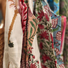 Block printed cotton sundress in assorted patterns with mother of pearl buttons, adjustable straps and calf-length skirt