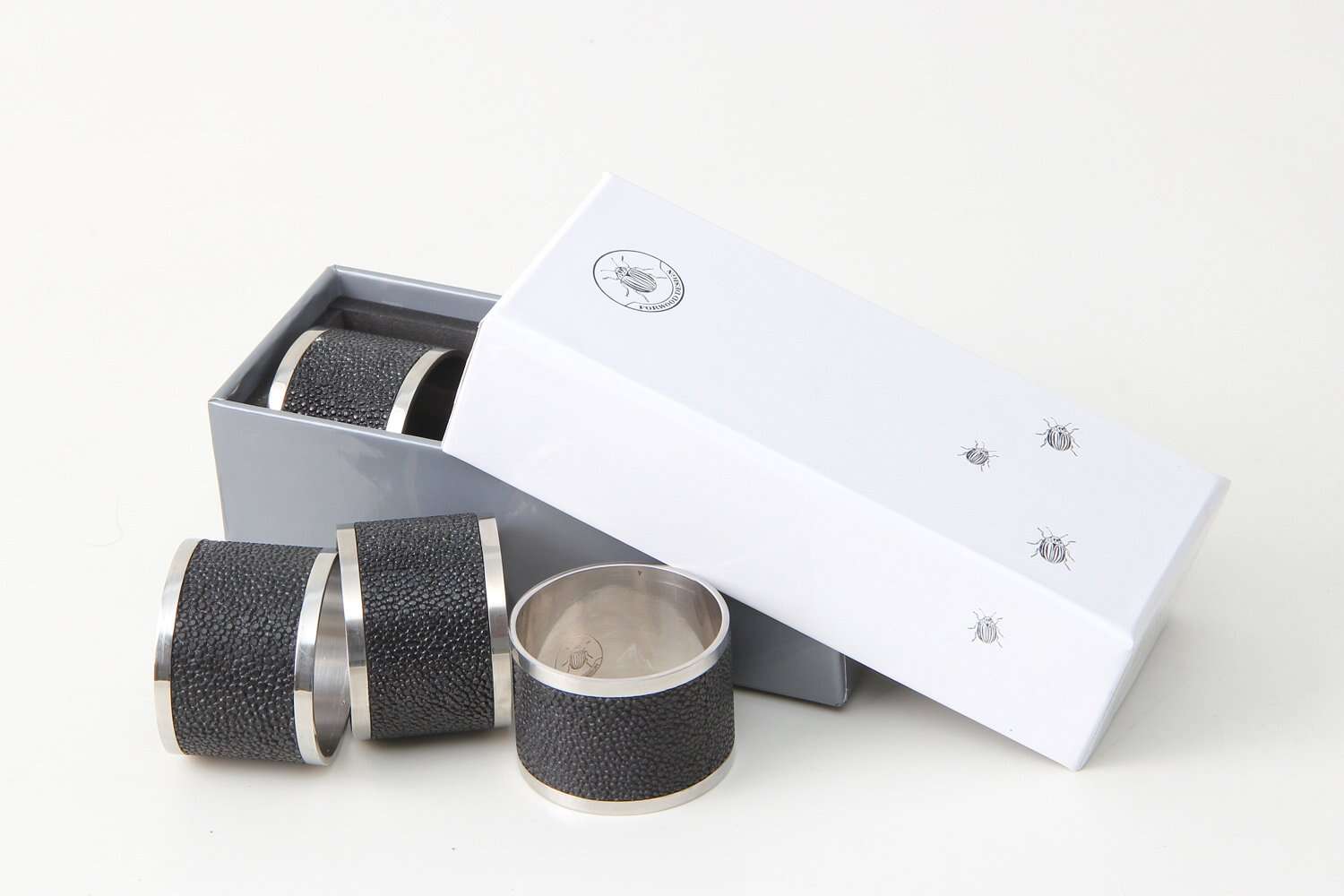 Set of 4 napkin rings in caviar black faux shagreen with stainless steel, 5 cm across for a dressed table