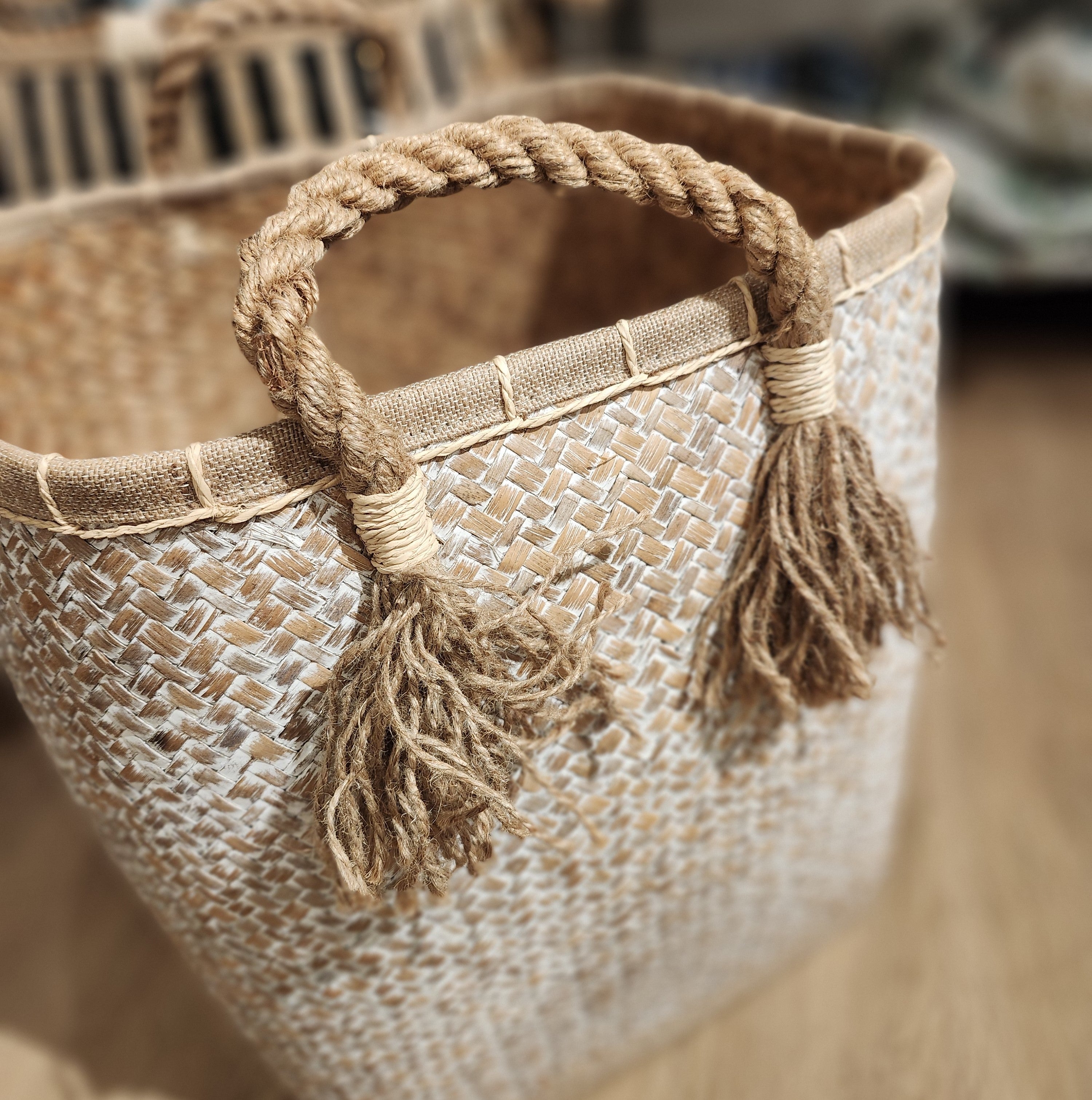 White wicker laundry basket, handwoven wicker storage basket in white, a rustic home organiser for laundry.