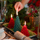 Poinsettia-shaped Christmas candle in natural wax, 14.5 cm tall, for festive table decoration