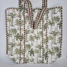 Quilted cotton shopper bag in white with a blue palm print, contrast lining, inner pocket and zip
