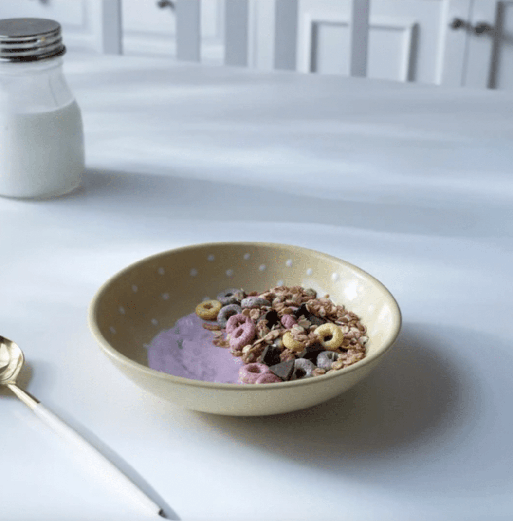 Handcrafted ceramic cereal bowl with a lemon polka dot design, 17.75 cm wide, for snacks or salad