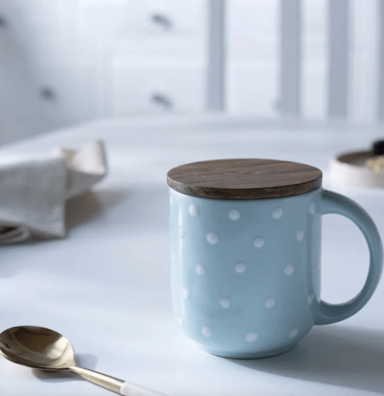 Tall ceramic mug in blue polka dots with a wooden lid that doubles as a coaster, 400 ml, handmade