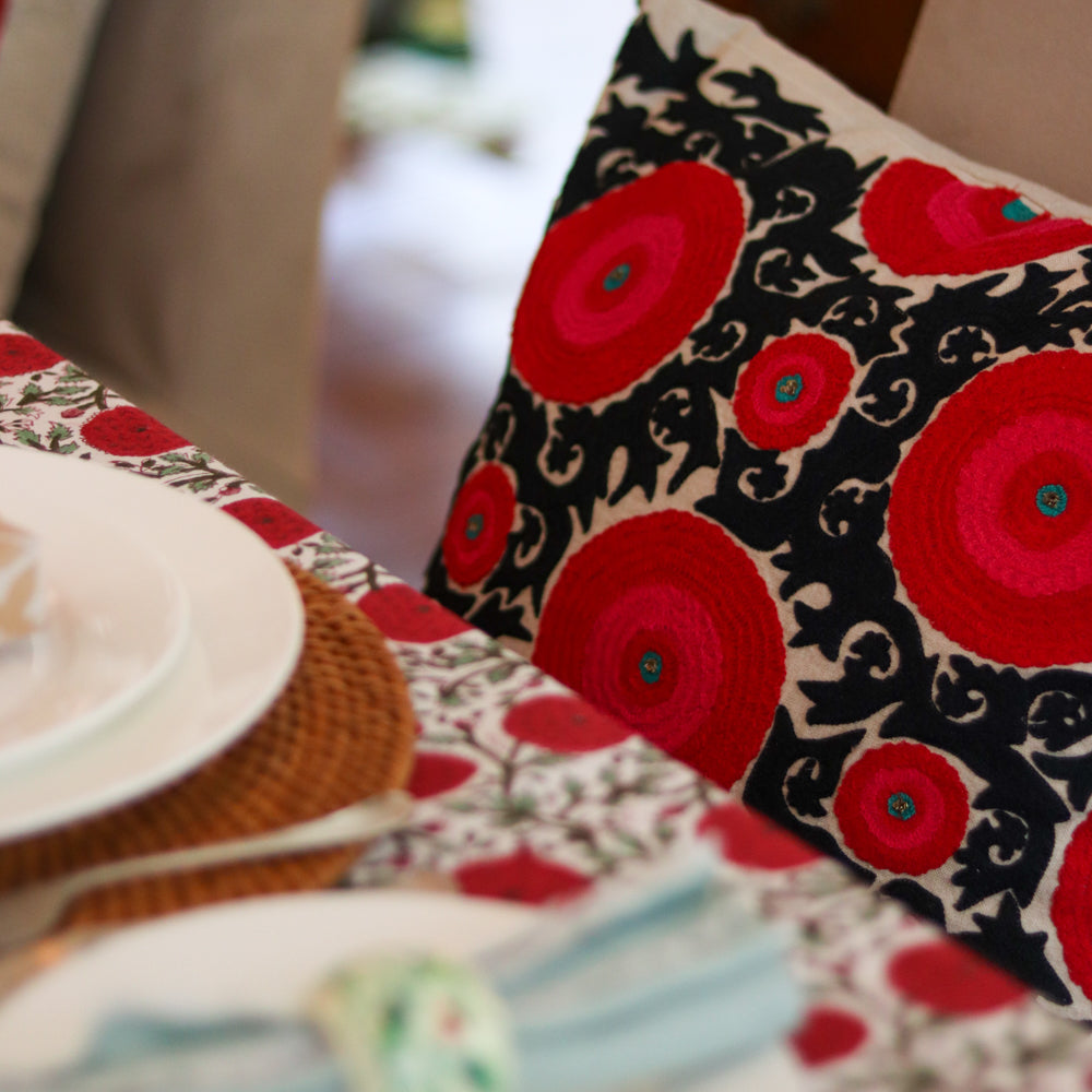 Linen suzani cushion cover in red and black with hot pink and a turquoise centre, 45 x 45 cm