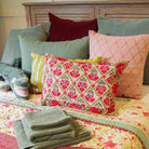 Suzani linen cushion Gulestaan, hand-embroidered in red, pink and green on natural linen, 35 x 50 cm