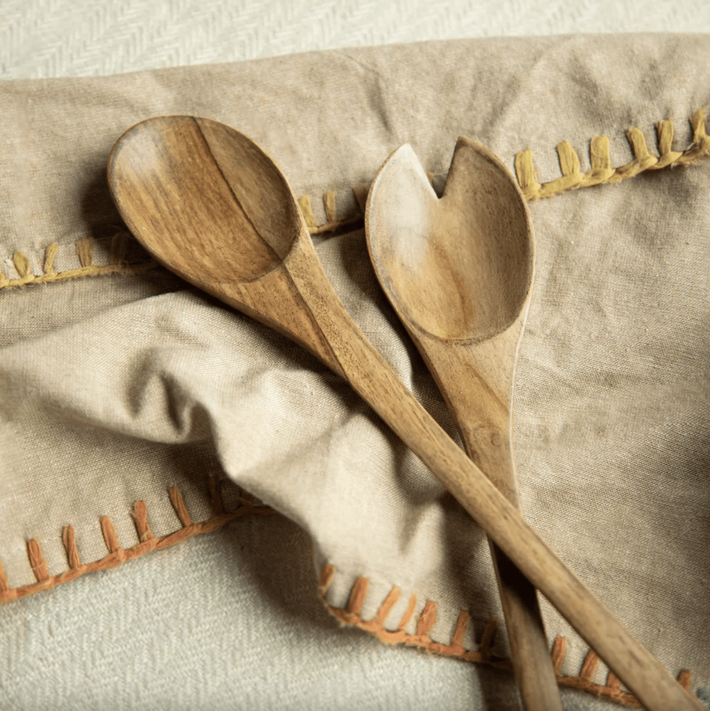 Set of two oval salad servers handcrafted from sheesham wood, 30 cm long, for tossing and serving