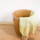 Seagrass laundry basket with handle detail, handwoven natural storage basket, a rustic home organiser with handle.