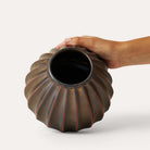 Salon Round Vase Bronze, part of the Vases collection at Inside Living Singapore, styled in a home setting.