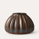 Salon Round Vase Bronze, part of the Vases collection at Inside Living Singapore, close-up of the texture.