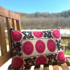 Suzani linen cushion Shiraz, hand-embroidered in red, pink and black with metalwork on linen, 35 x 50 cm