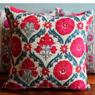 Suzani Niksaar linen cushion in red and blue with embroidered detail, from Inside Living Singapore Side view.