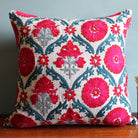 Suzani Niksaar cushion in natural linen, 45 x 45 cm, hand-embroidered lattice pattern in red, pink, blue and grey