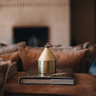 Festive scented candle in a hammered brass tajine with pine, spice and mandarin notes, 60-hour burn