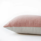 Coral diamond cushion detail, geometric patterned cushion in coral adding colour to a sofa, bed or chair.