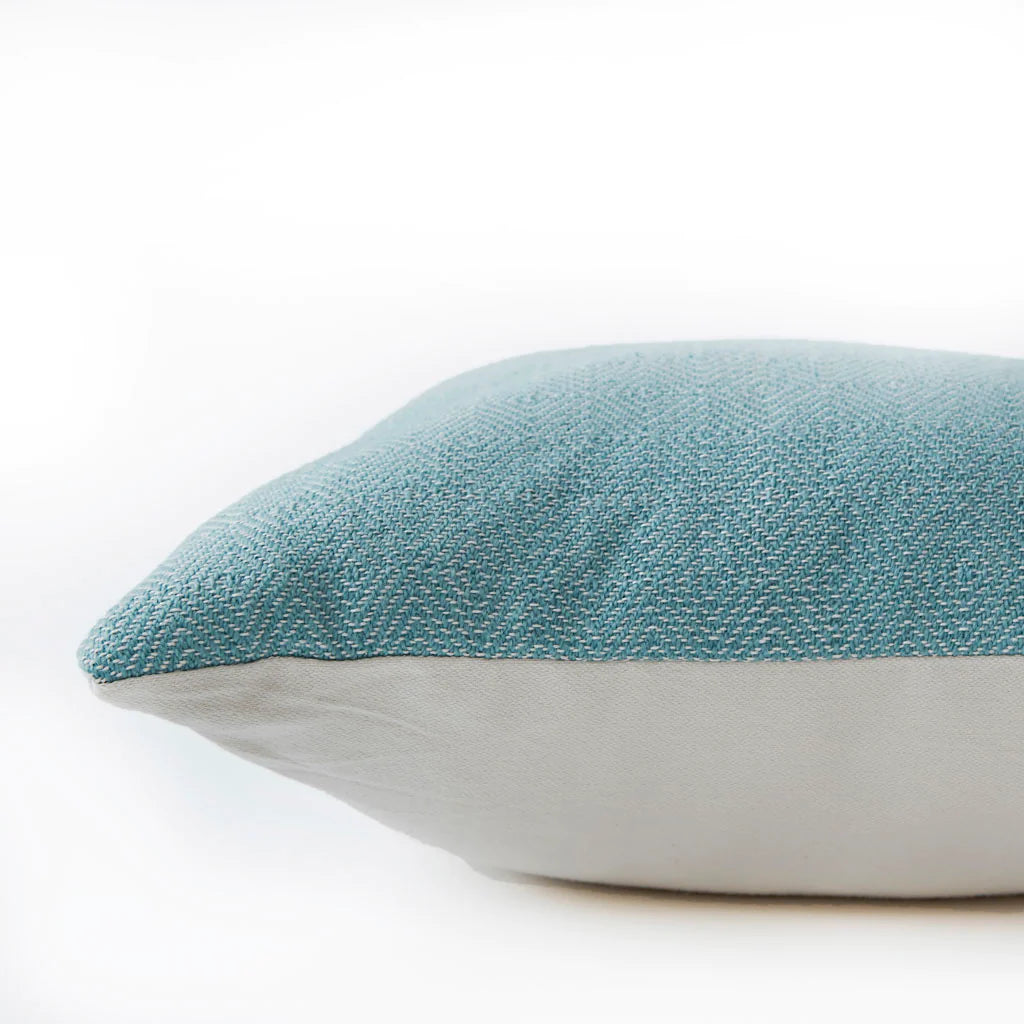 Teal diamond cushion detail, geometric patterned cushion in rich teal adding colour to a sofa or chair.