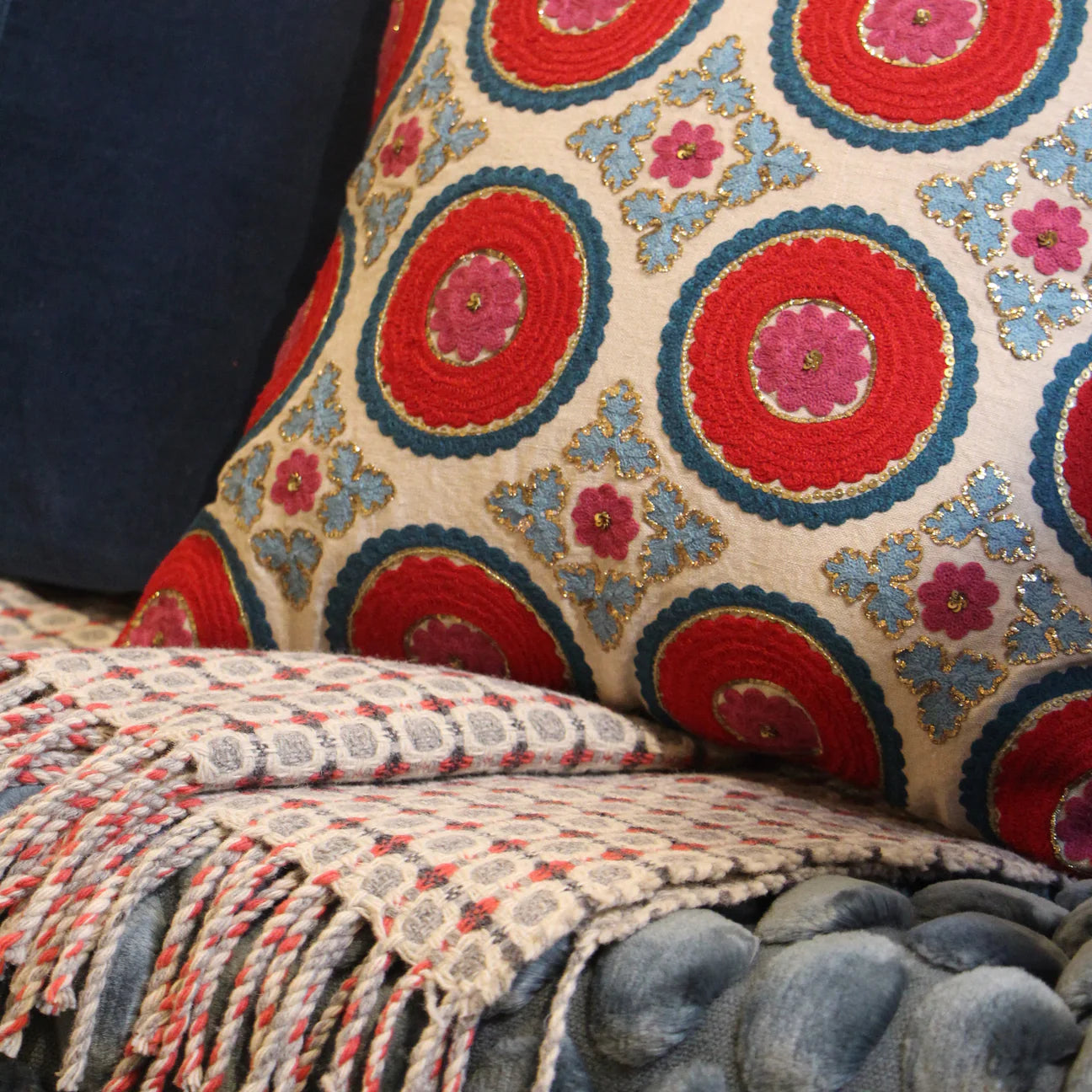 Suzani Kokand cushion in red linen, 45 x 45 cm, hand-embroidered in red, teal and turquoise with gold sitara stitching