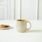 Amber Love ceramic mug, handmade glazed coffee and tea mug in warm amber tones for everyday kitchen use.