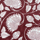 Block-print cotton tablecloth in burgundy lotus design, 170 x 270 cm, from Inside Living Singapore Front view.
