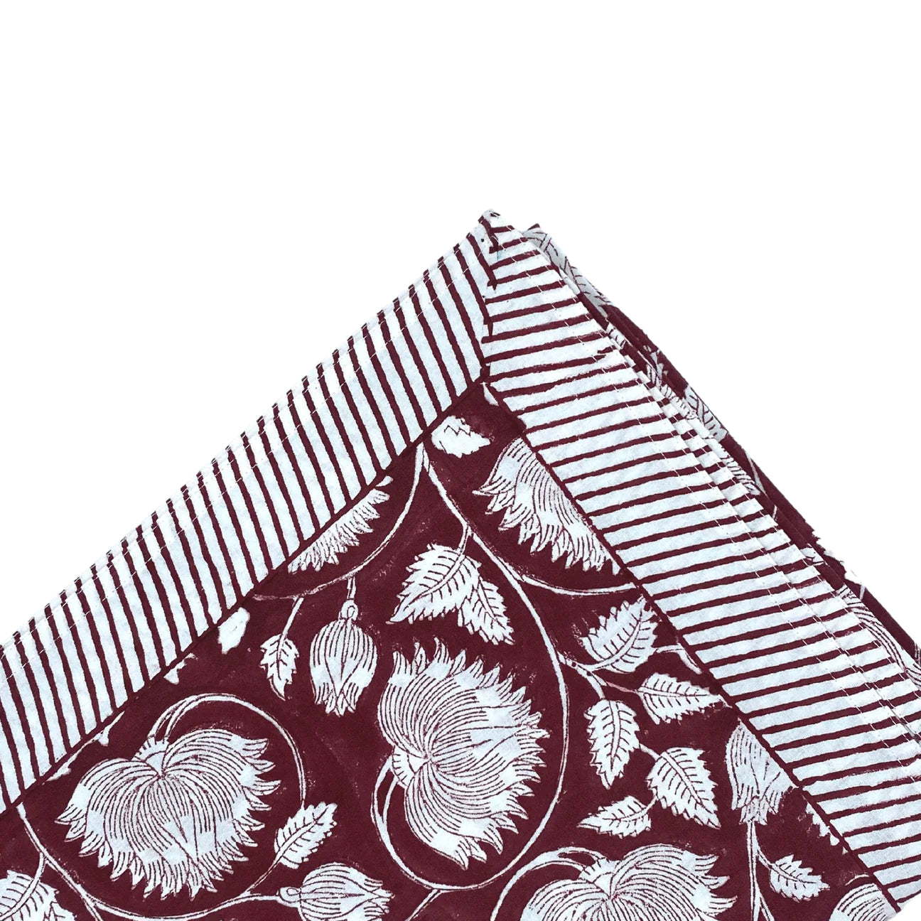 Block-print cotton tablecloth in burgundy lotus design, 170 x 270 cm, from Inside Living Singapore Side view.