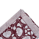 Block-print cotton tablecloth in burgundy lotus design, 170 x 270 cm, from Inside Living Singapore Side view.