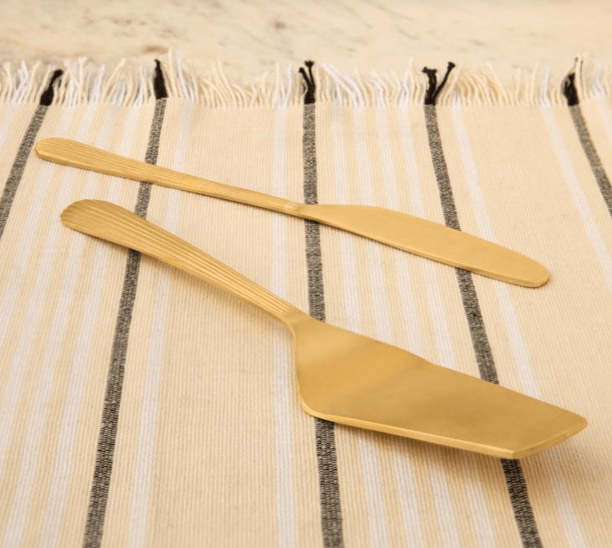 Celestial Brass Cake Slice Spoon Set of 2 from Inside Living Singapore. Detail view.