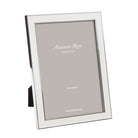 White enamel and silver-plate photo frame with grey velvet back, holds 4 x 6, 5 x 7 or 8 x 10 inch photos