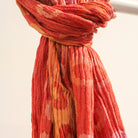 Handwoven silk scarf detail, red polka dot pattern, a soft lightweight artisan scarf and versatile accessory.