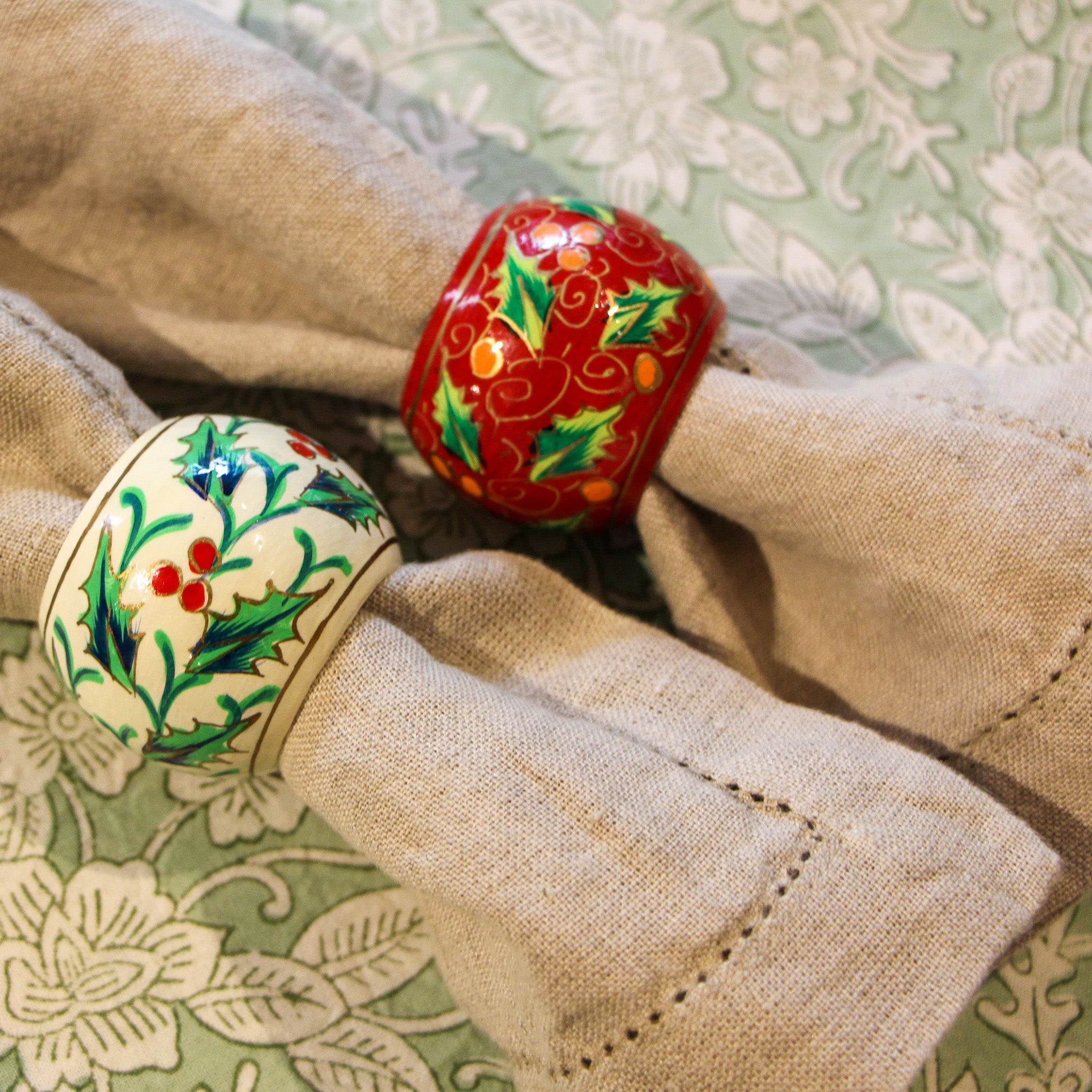 Set of six hand-painted holly napkin rings with leaves and berries, handmade in Kashmir
