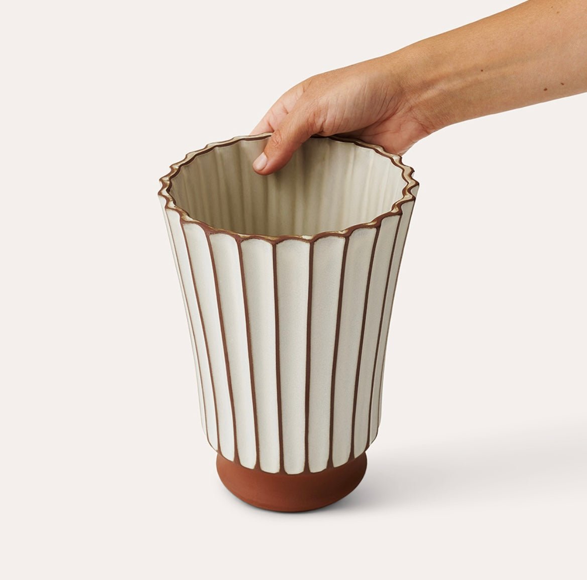 Sthal Salon high ribbed vase in putty, high-fired terracotta, 20 cm diameter, styled in a room setting