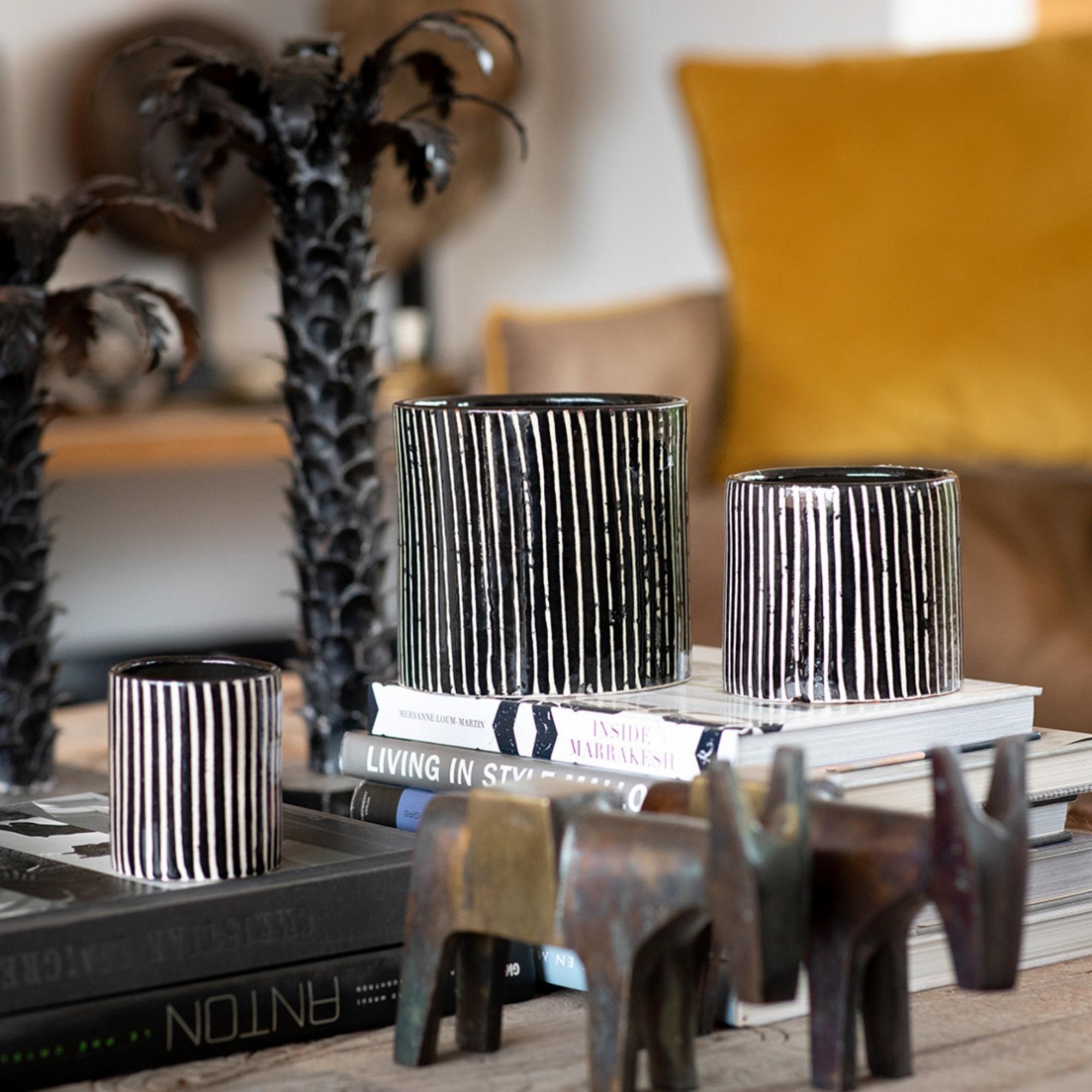 Mandarin-scented soy wax candle in a zebra-stripe ceramic pot, reusable as a vase or holder