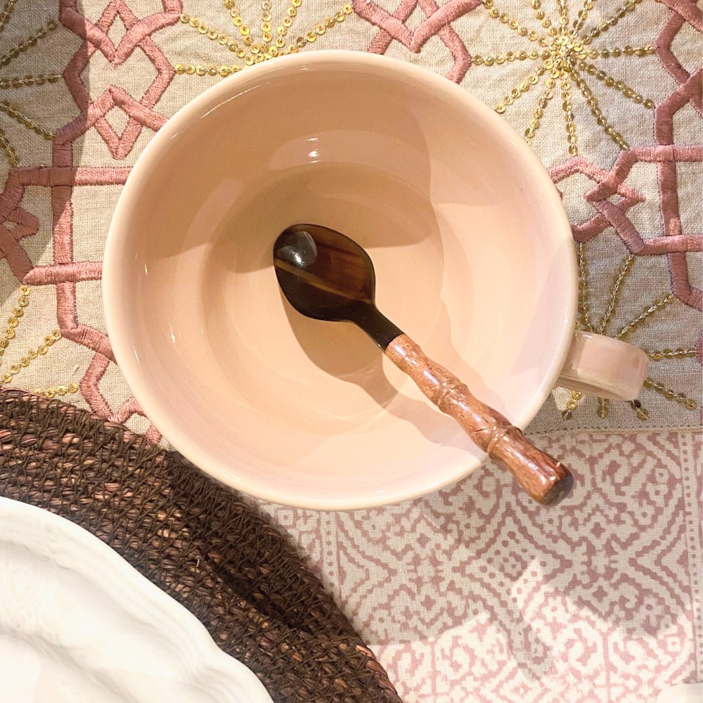 Horn teaspoon with a bamboo handle, handcrafted natural serving spoon, an eco-friendly accent for table or kitchen.